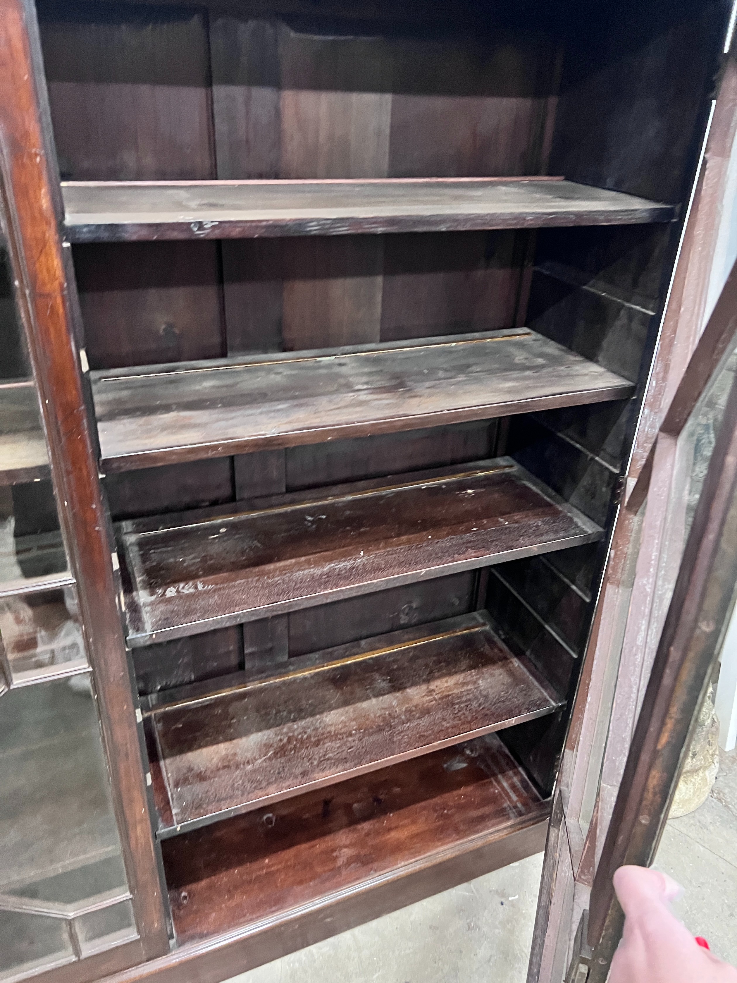 A George III mahogany two door bookcase, adapted, width 164cm, depth 40cm, height 159cm, *Please note the sale commences at 9am.